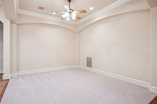 Dining room with crown molding, ceiling fan, recessed lighting, and new carpet. | Image 27