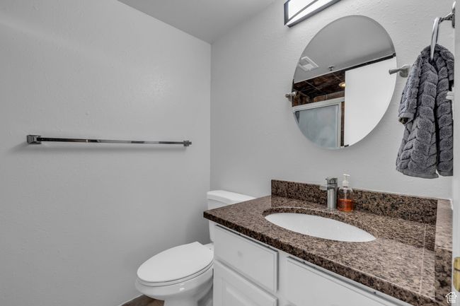 Bathroom with toilet and vanity | Image 11
