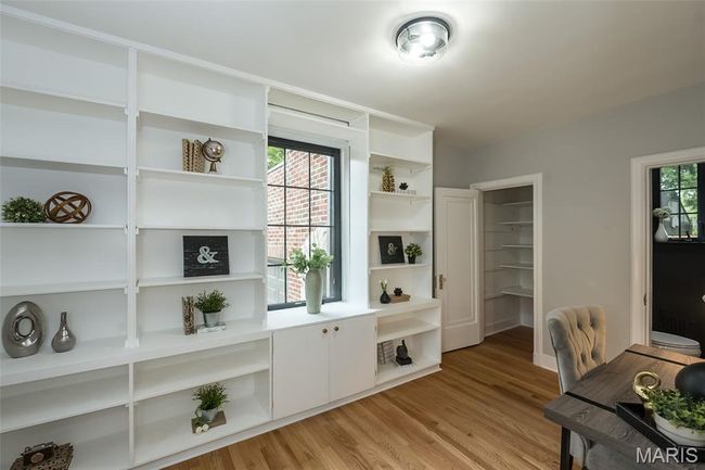 Office featuring light wood finished floors and could be used a guest bedroom. | Image 17