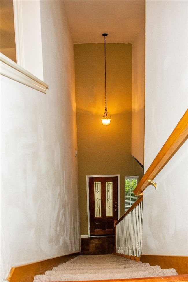 Stairway with a towering ceiling | Image 10