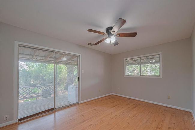 Primary bedroom with direct access to the porch for your morning coffee. | Image 20