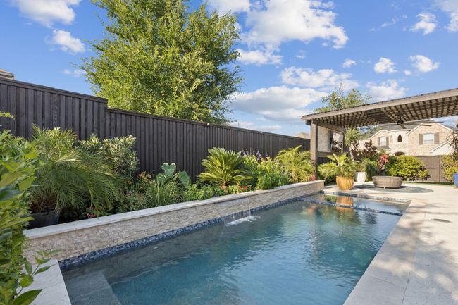 View of pool featuring a fenced backyard and a patio | Image 29