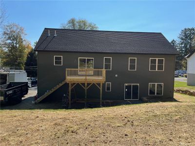 Back of property with a deck and a lawn walkway | Image 2