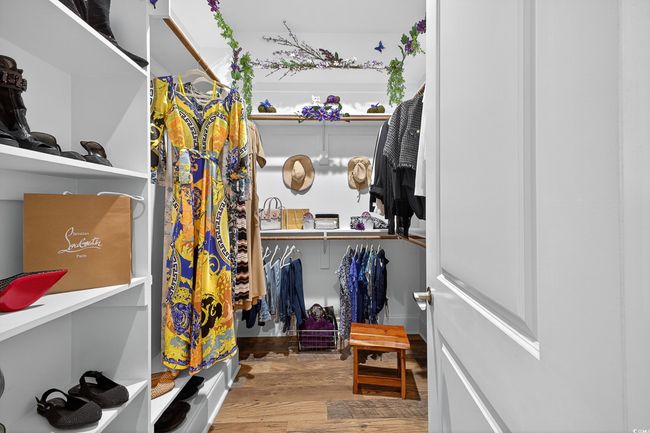 Spacious closet featuring wood finished floors | Image 21