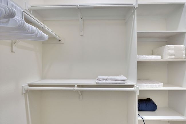 View of spacious closet | Image 15