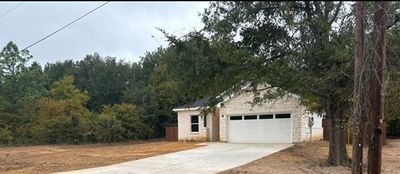 View of front facade with a garage | Image 1