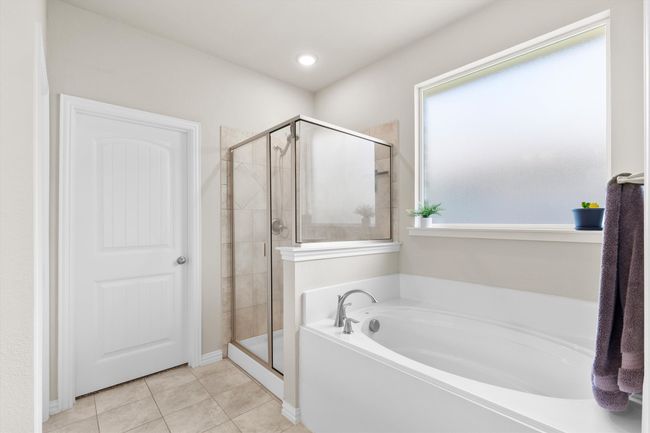 Full bathroom with a garden tub, a shower stall, and tile patterned flooring | Image 18