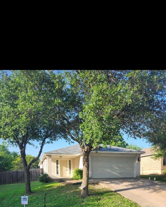 View of front of home featuring an attached garage and concrete driveway | Image 26