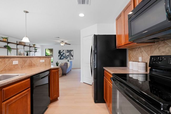 On the other side of the bar is this practical prep space. | Image 9
