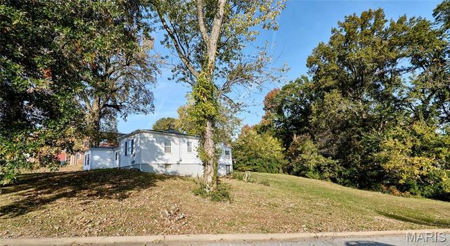 View of side of property with a yard | Image 16