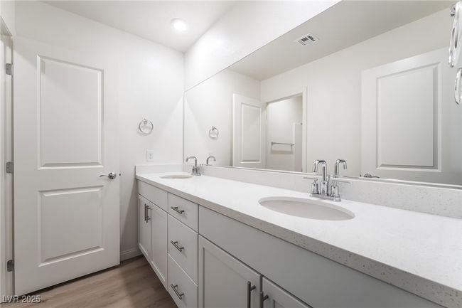 Full bathroom with double vanity, wood finished floors, and recessed lighting | Image 32