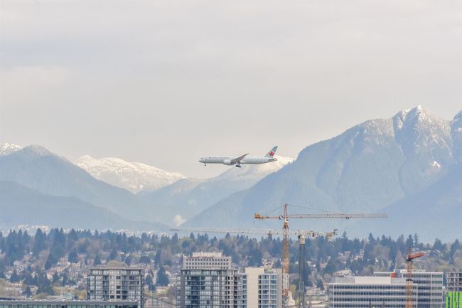 View of mountain backdrop featuring nearby urban area | Image 21