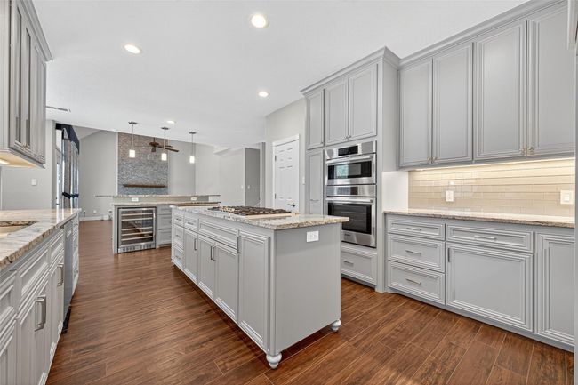 Kitchen with gas cooktop in Island and hidden Pop-Up TV, can you find it? | Image 19
