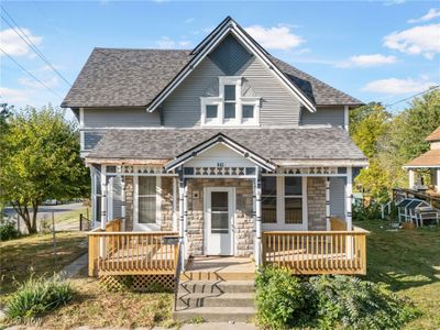 View of front of house with a front yard and a porch | Image 1