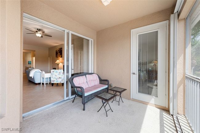 Sunroom featuring a ceiling fan | Image 31