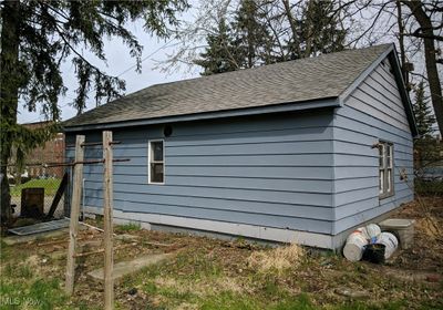 View of side of property with an outdoor structure | Image 3