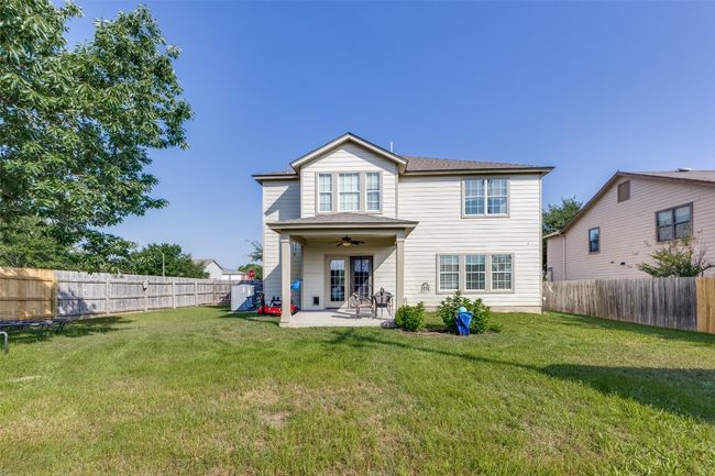 Back of house with ceiling fan and a patio | Image 38