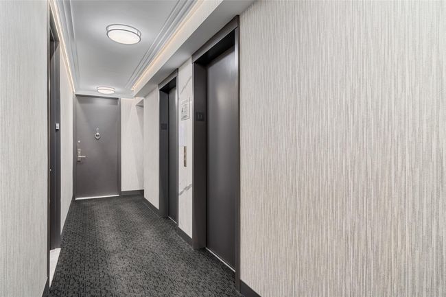 Hallway featuring elevator and baseboards | Image 20