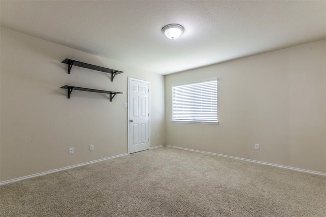 Spare room featuring baseboards and light colored carpet | Image 26
