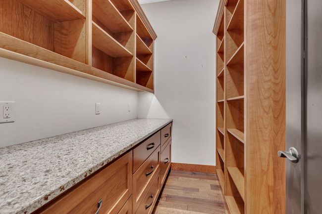 A generous pantry behind the main kitchen with so much storage room. | Image 45