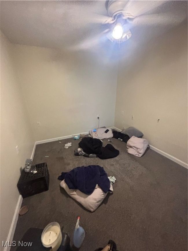 Unfurnished bedroom featuring carpet, baseboards, and a ceiling fan | Image 8