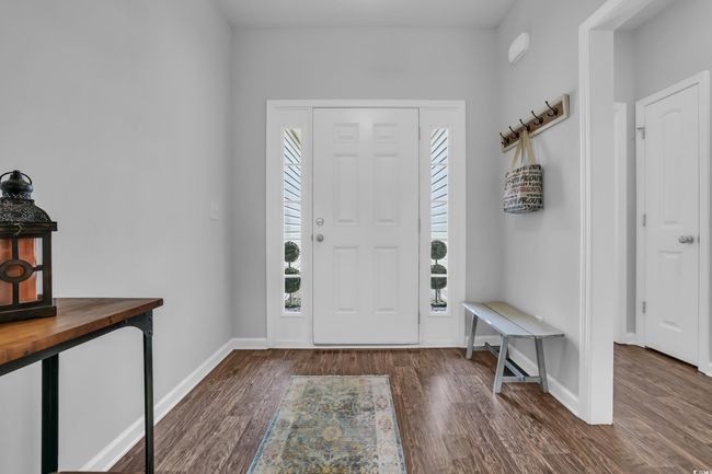 Foyer with baseboards and wood finished floors | Image 8