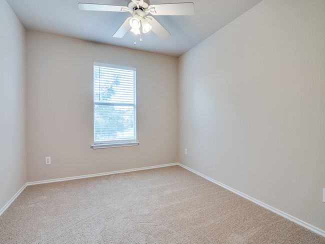 Unfurnished room featuring carpet and a ceiling fan | Image 9