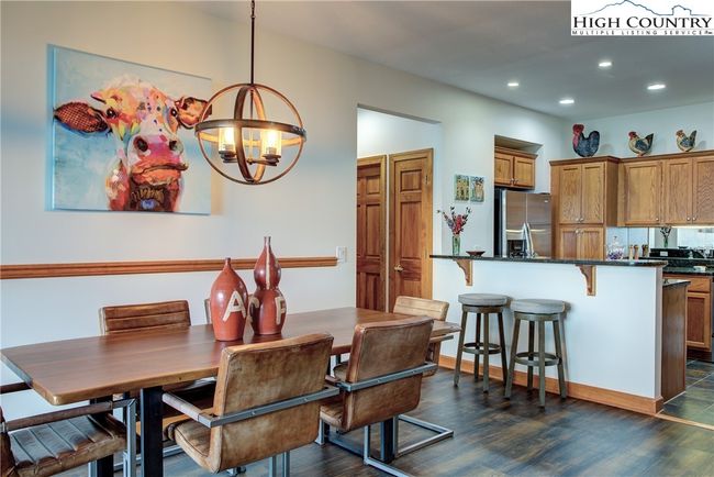 Hallway beyond leads to the guest suite and ensuite bath. Note there's plenty of room for entertaining. | Image 22