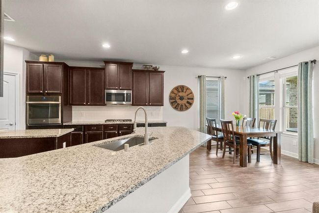 Lots of counter space makes this a great hosting spot. | Image 11
