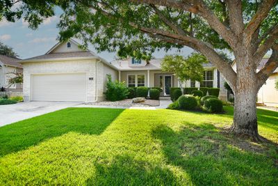 Attractive curb appeal with mature landscaping and trees already in place. | Image 2