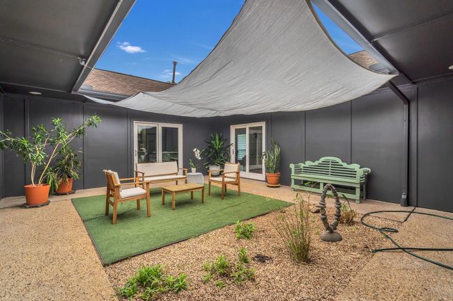 View of patio featuring an outdoor hangout area | Image 35