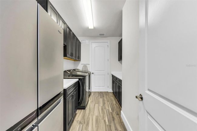 extra refrigerator in laundry room | Image 33