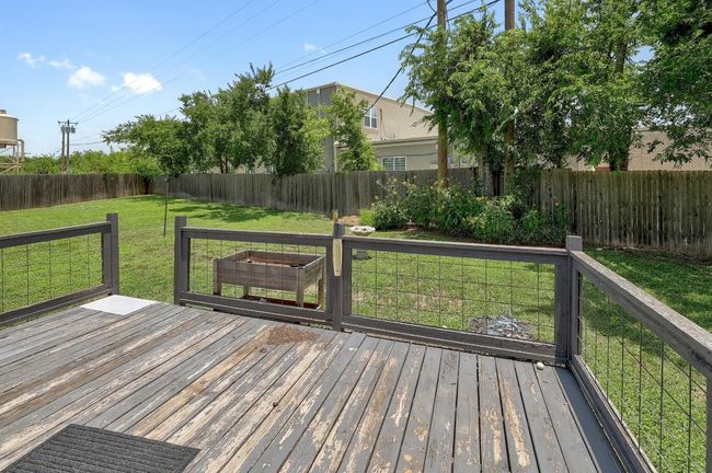 Wooden terrace featuring a fenced backyard | Image 24
