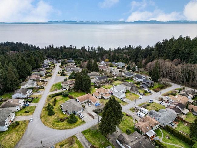 Drone / aerial view with a water view, a wooded view, and a residential view | Image 31