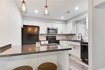 Stylish lighting and newer appliances | Image 2