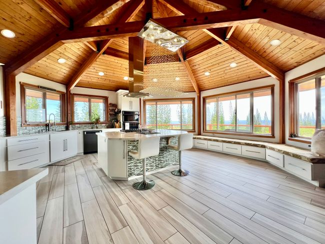 Expansive kitchen, raindrop chandelier, bay window seating and storage galore! | Image 4