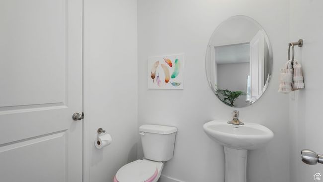 Half bathroom featuring toilet | Image 14