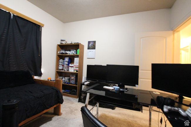 Bedroom featuring light carpet | Image 14