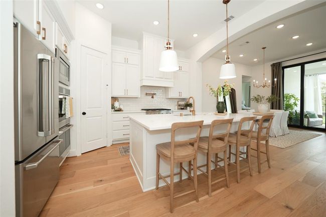 Seamlessly integrated kitchen and living area for effortless entertaining and connection. | Image 6