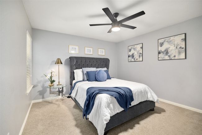 Carpeted bedroom featuring baseboards and ceiling fan | Image 21