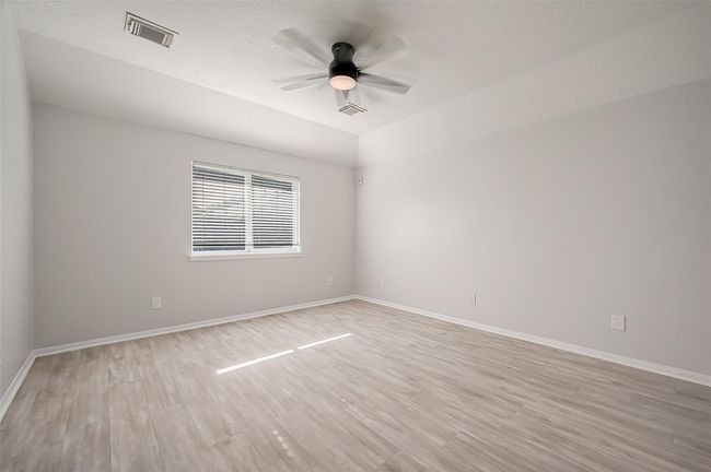 Primary bedroom located in the rear of the home | Image 20
