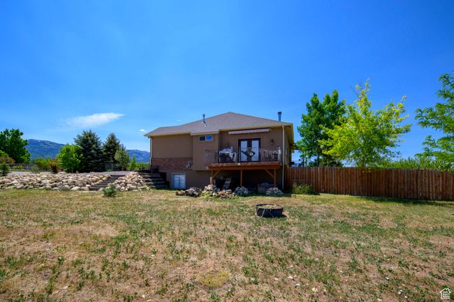 North side of home with walkout deck from formal dinning area | Image 34