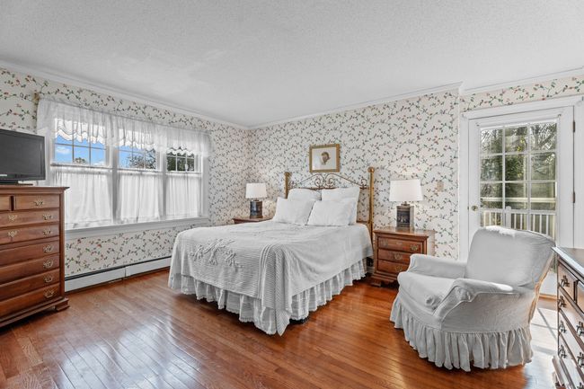 Primary bedroom with balcony | Image 25