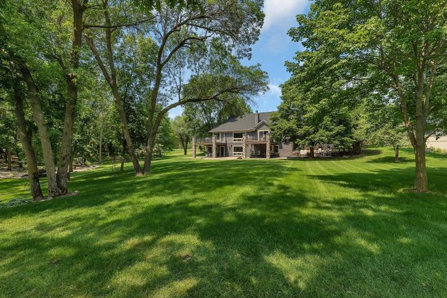 Gently sloping lawn to sandy beach and water. | Image 37