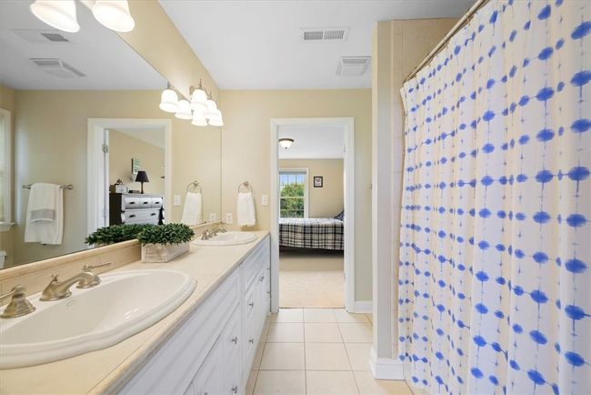 A Jack-n-Jill bathroom services the third and fourth bedrooms. | Image 33