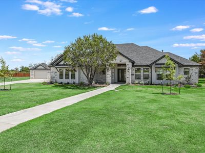 Welcome to 112 Tesoro Perdido Cove! This stunning newly built custom home is situated on an extra large 1.89 acre lot in a quiet cul-de-sac location of the Tesoro Subdivision in Liberty Hill! Fully landscaped and irrigated in the front, sides and partial rear. All sides masonry, full seamless metal rain gutters, and partially fenced. 3-Car attached garage with a 20'x 30' detached garage/workshop! | Image 2