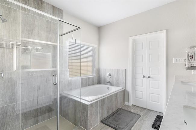 Over-sized shower, soaking tub, and double sinks. | Image 22