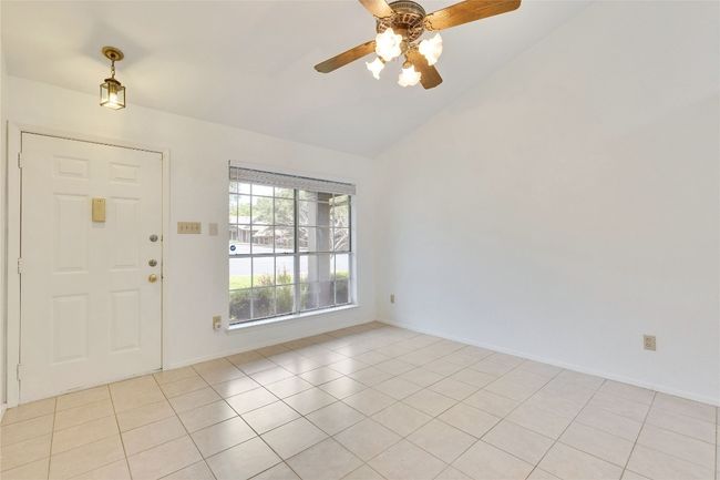 Foyer with ceiling fan, vaulted ceiling, and light tile patterned floors | Image 5