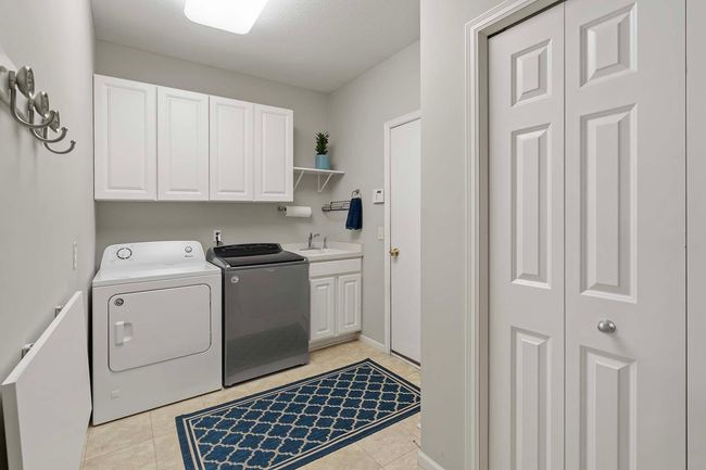 Entry from garage through the main floor laundry. | Image 15