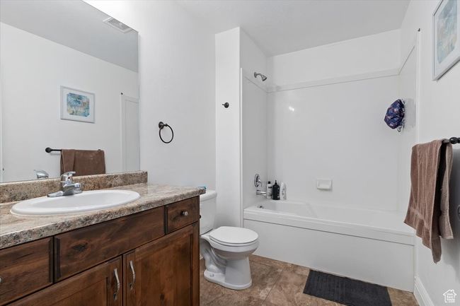 Full bathroom with vanity, toilet, and shower / bathtub combination | Image 24